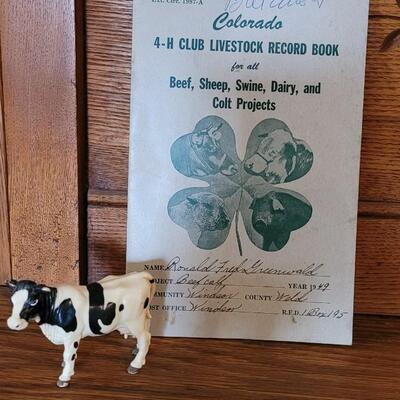 Lot 325: 1944 Weld County 4H Livestock Record Book and Vintage Cow Toy
