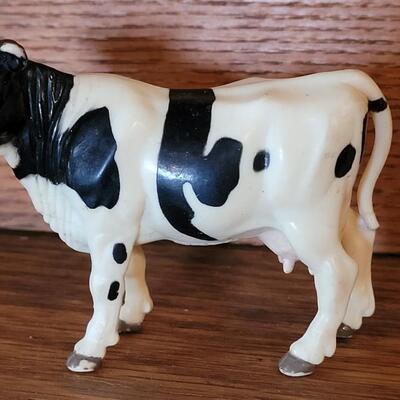 Lot 325: 1944 Weld County 4H Livestock Record Book and Vintage Cow Toy