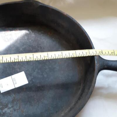 Lot 6- Cast Iron Frying Pan - Name not readable