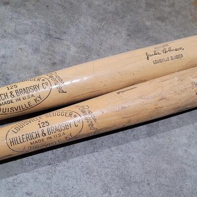 Lot 379: Vintage Pair of Louisville Slugger Wood Baseball Bats (Jackie Robinson and Roberto Clemente) - Robinson has a crack