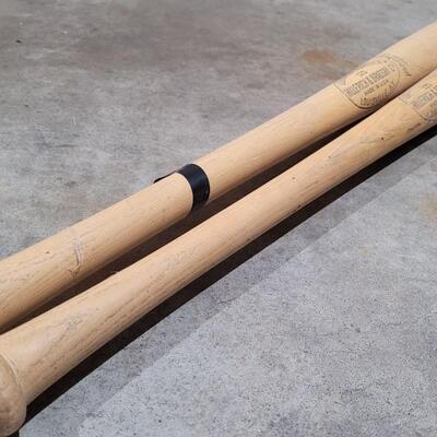 Lot 379: Vintage Pair of Louisville Slugger Wood Baseball Bats (Jackie Robinson and Roberto Clemente) - Robinson has a crack