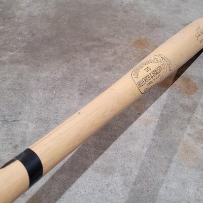 Lot 379: Vintage Pair of Louisville Slugger Wood Baseball Bats (Jackie Robinson and Roberto Clemente) - Robinson has a crack