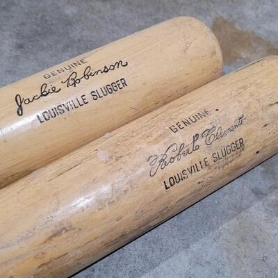 Lot 379: Vintage Pair of Louisville Slugger Wood Baseball Bats (Jackie Robinson and Roberto Clemente) - Robinson has a crack