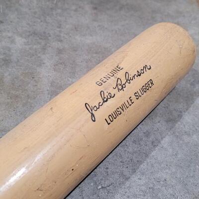 Lot 379: Vintage Pair of Louisville Slugger Wood Baseball Bats (Jackie Robinson and Roberto Clemente) - Robinson has a crack
