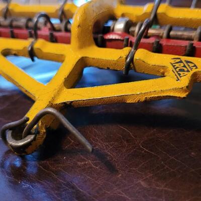 Lot 384: Vintage ARCADE TOYS 7" Cast Iron Farm Tractor Plow Toy w/ Chippy Original Paint 