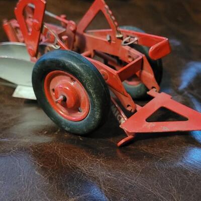Lot 385: Vintage McCormick Plow + Vintage Metal Cutter 