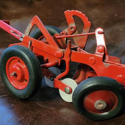 Lot 385: Vintage McCormick Plow + Vintage Metal Cutter 