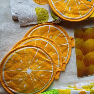 Lot 30: (2) Citrus Glass Cutting Boards & Citrus Pot Holders and Kitchen Towels