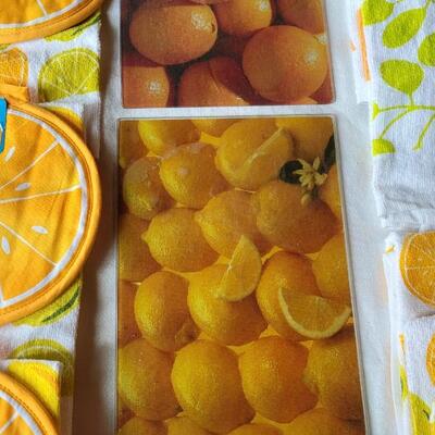 Lot 30: (2) Citrus Glass Cutting Boards & Citrus Pot Holders and Kitchen Towels