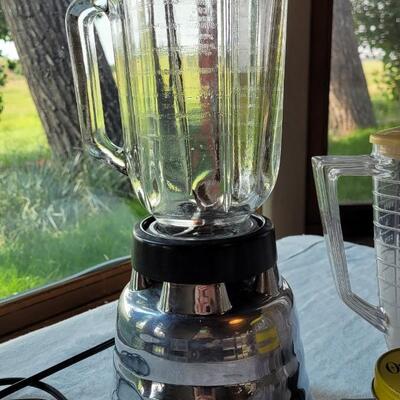 Lot 31: Vintage Oster Silver Blender with 2 extra Pitchers & 3 Jars