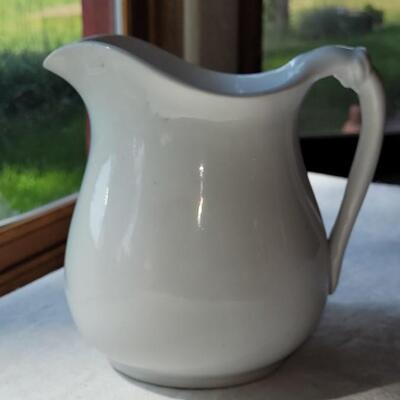 Lot 45: Antique White Dresden Stone & The Potter's Co-op Pitcher made in East Liverpool, Ohio