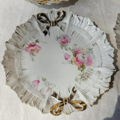 Lot 49: Ivory Italian Platter with Bows and unmarked China Plates and Bow Napkin Rings