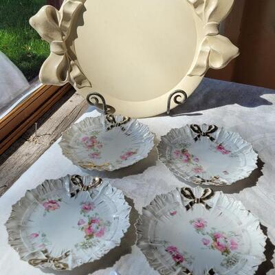 Lot 49: Ivory Italian Platter with Bows and unmarked China Plates and Bow Napkin Rings