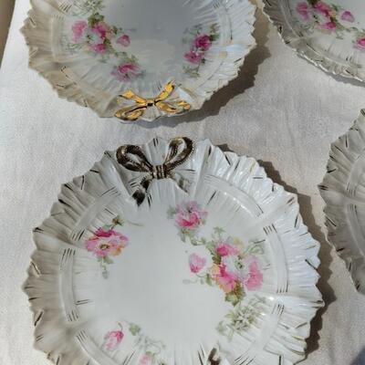 Lot 49: Ivory Italian Platter with Bows and unmarked China Plates and Bow Napkin Rings