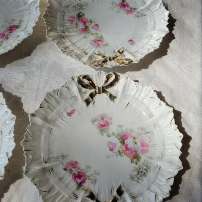 Lot 49: Ivory Italian Platter with Bows and unmarked China Plates and Bow Napkin Rings