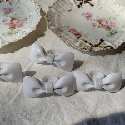 Lot 49: Ivory Italian Platter with Bows and unmarked China Plates and Bow Napkin Rings