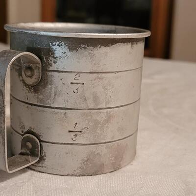 Lot 120: Antique Measuring Cups, Spoon & Match Holder