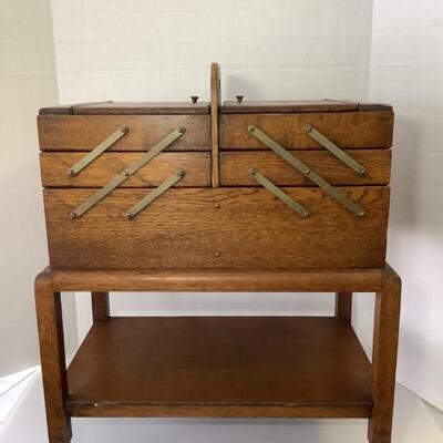B - 118. Antique Mahogany Rolling Sewing Cabinet 