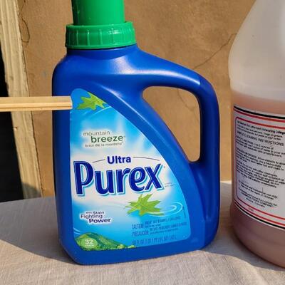 Lot 169: PUREX Laundry Detergent and PINK Hand Soap Concentrate (See Ruler Spot for Level)