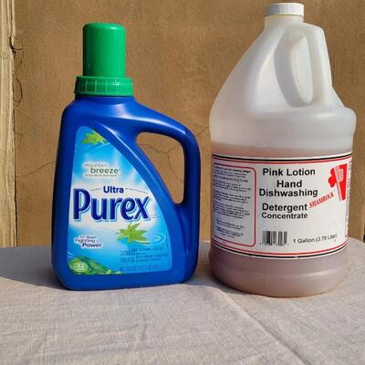 Lot 169: PUREX Laundry Detergent and PINK Hand Soap Concentrate (See Ruler Spot for Level)