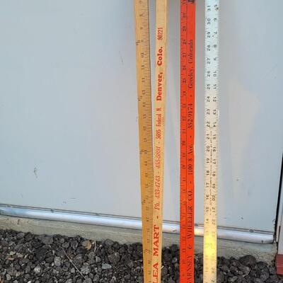 Lot 211: Assortment of (4) Vintage Yard Sticks