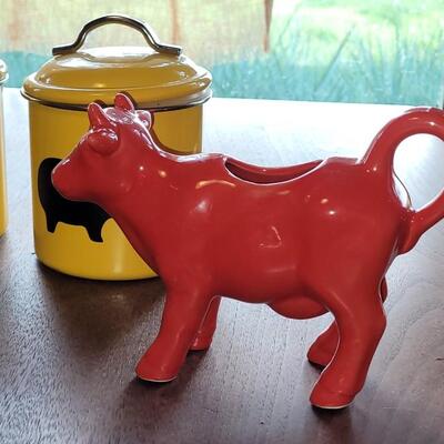 Lot 279: (4) Yellow Cannisters with Pigs, Red Cow Creamer and Red Pig Mug