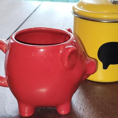 Lot 279: (4) Yellow Cannisters with Pigs, Red Cow Creamer and Red Pig Mug