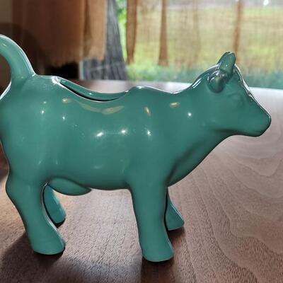 Lot 280: Turquois Cannisters with Cows, Cow Creamer and (2) Nantucket Bread Dishes 