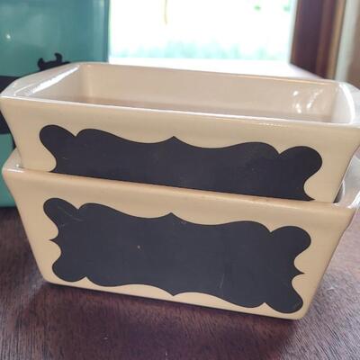 Lot 280: Turquois Cannisters with Cows, Cow Creamer and (2) Nantucket Bread Dishes 