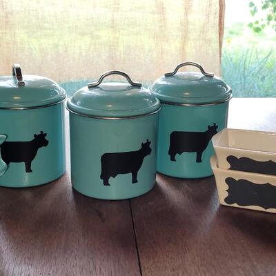 Lot 280: Turquois Cannisters with Cows, Cow Creamer and (2) Nantucket Bread Dishes 