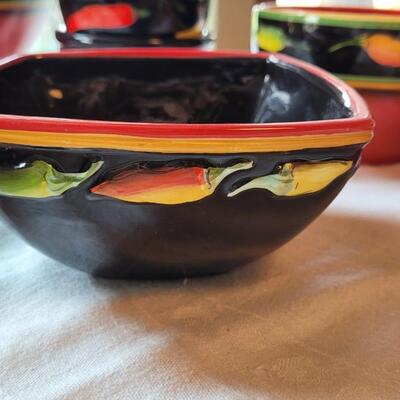 Lot 304: Clay Art and Chili Pepper Dishes, 2 unmarked Black Plates & Bowl  & 3 Napkins