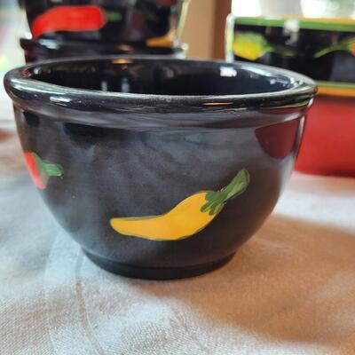 Lot 304: Clay Art and Chili Pepper Dishes, 2 unmarked Black Plates & Bowl  & 3 Napkins