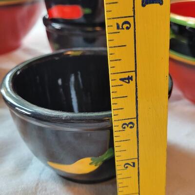 Lot 304: Clay Art and Chili Pepper Dishes, 2 unmarked Black Plates & Bowl  & 3 Napkins