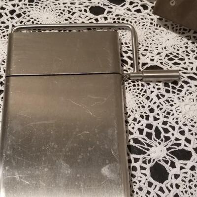 Lot 392: Kitchen Cheese Slicer and Handi Magic Hand Mill