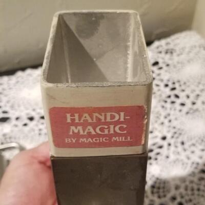 Lot 392: Kitchen Cheese Slicer and Handi Magic Hand Mill