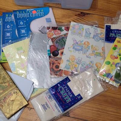 Lot 460: Assortment of Deco Paper and Silicone Book Covers (Plastic Bin included)