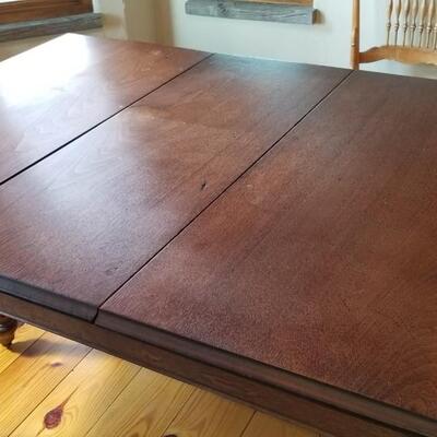Lot 494: Vintage Dining Table with 3 Leaves - there are 2 on the table in the photo