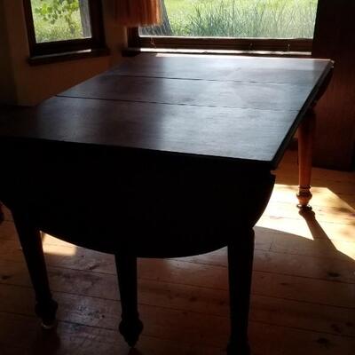 Lot 494: Vintage Dining Table with 3 Leaves - there are 2 on the table in the photo