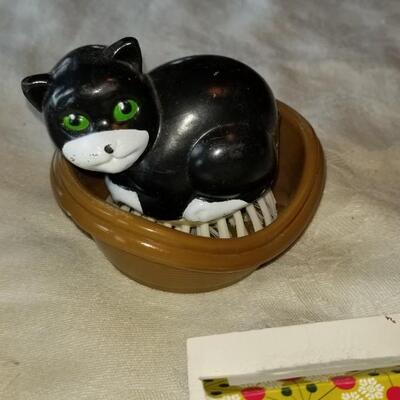 Lot 497: Soaps, Ceramic soap dish, Stainless soap dishes & Cat Scrubber 