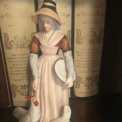 #214 porcelain figurines woman feeding chickens man playing bagpipes