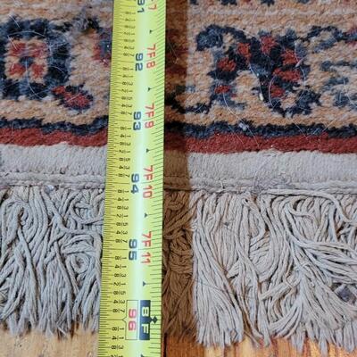 Lot 579: Area Rug- has a spot with wear