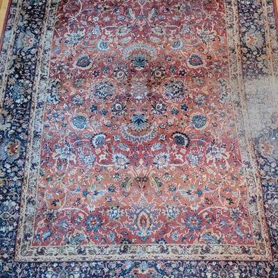 Lot 579: Area Rug- has a spot with wear