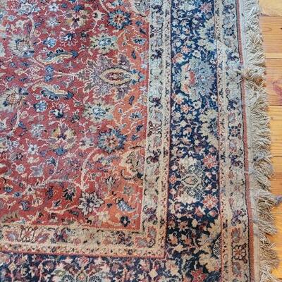 Lot 579: Area Rug- has a spot with wear