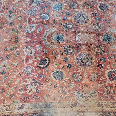 Lot 579: Area Rug- has a spot with wear