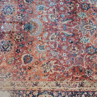 Lot 579: Area Rug- has a spot with wear