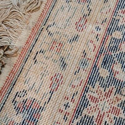 Lot 579: Area Rug- has a spot with wear