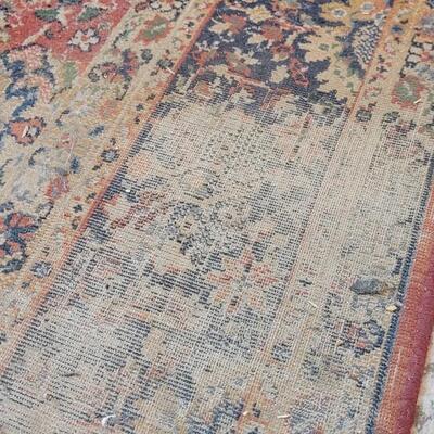 Lot 579: Area Rug- has a spot with wear