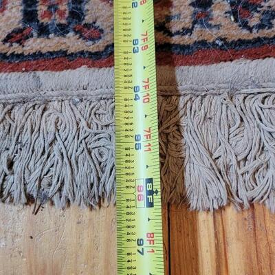 Lot 579: Area Rug- has a spot with wear