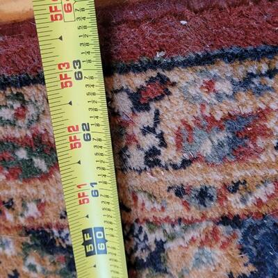 Lot 579: Area Rug- has a spot with wear