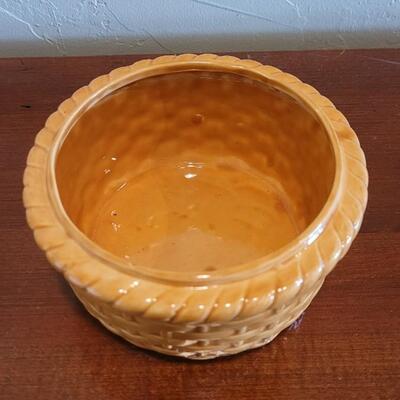 Lot 591: Ceramic Hen Sitting on a Basket Dish
